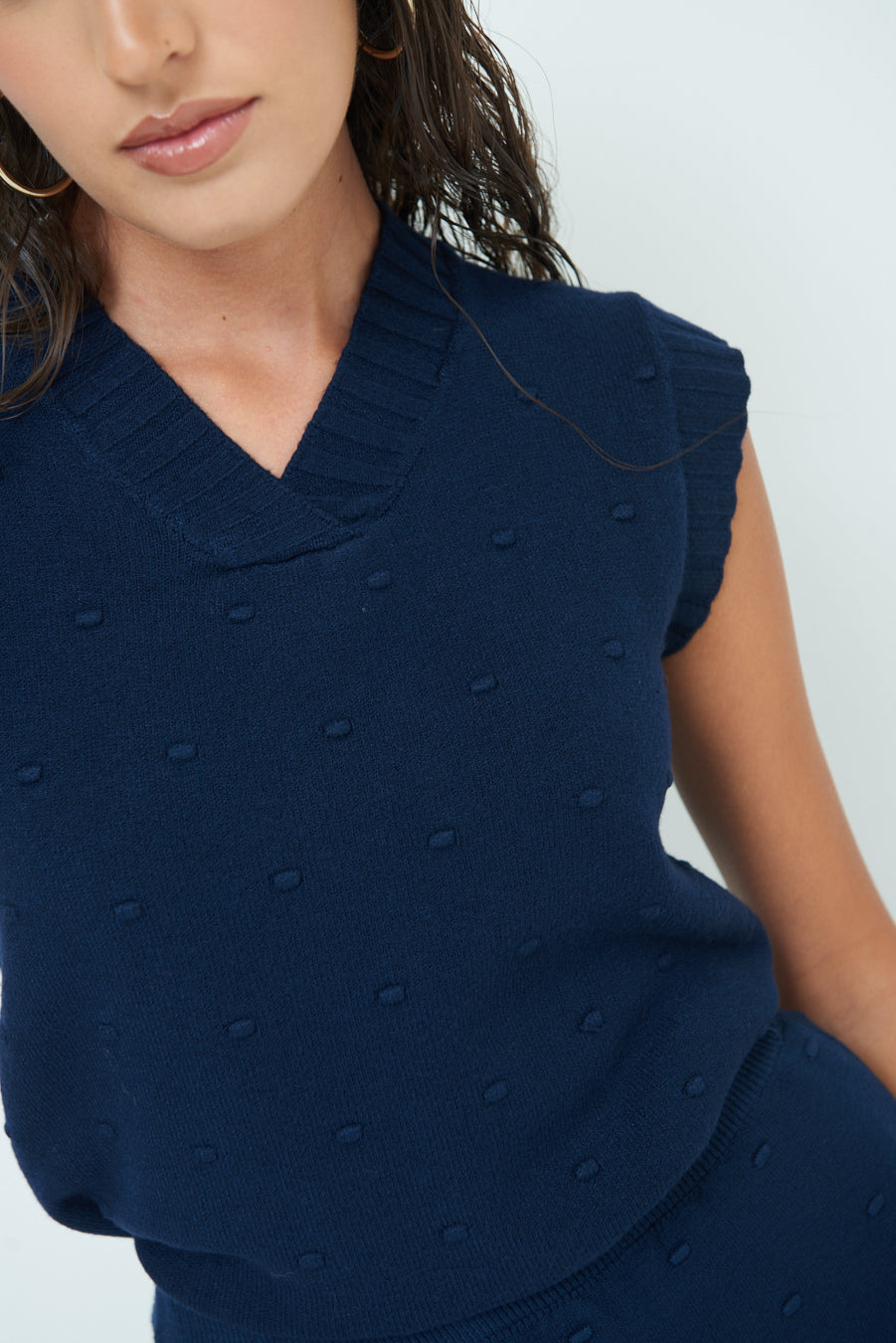 Sleeveless knit top with textured pattern wholesale