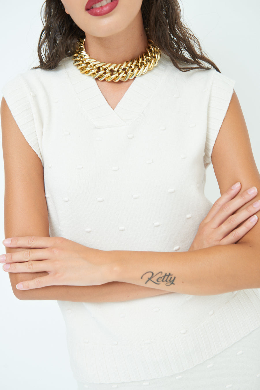 Sleeveless knit top with textured pattern wholesale
