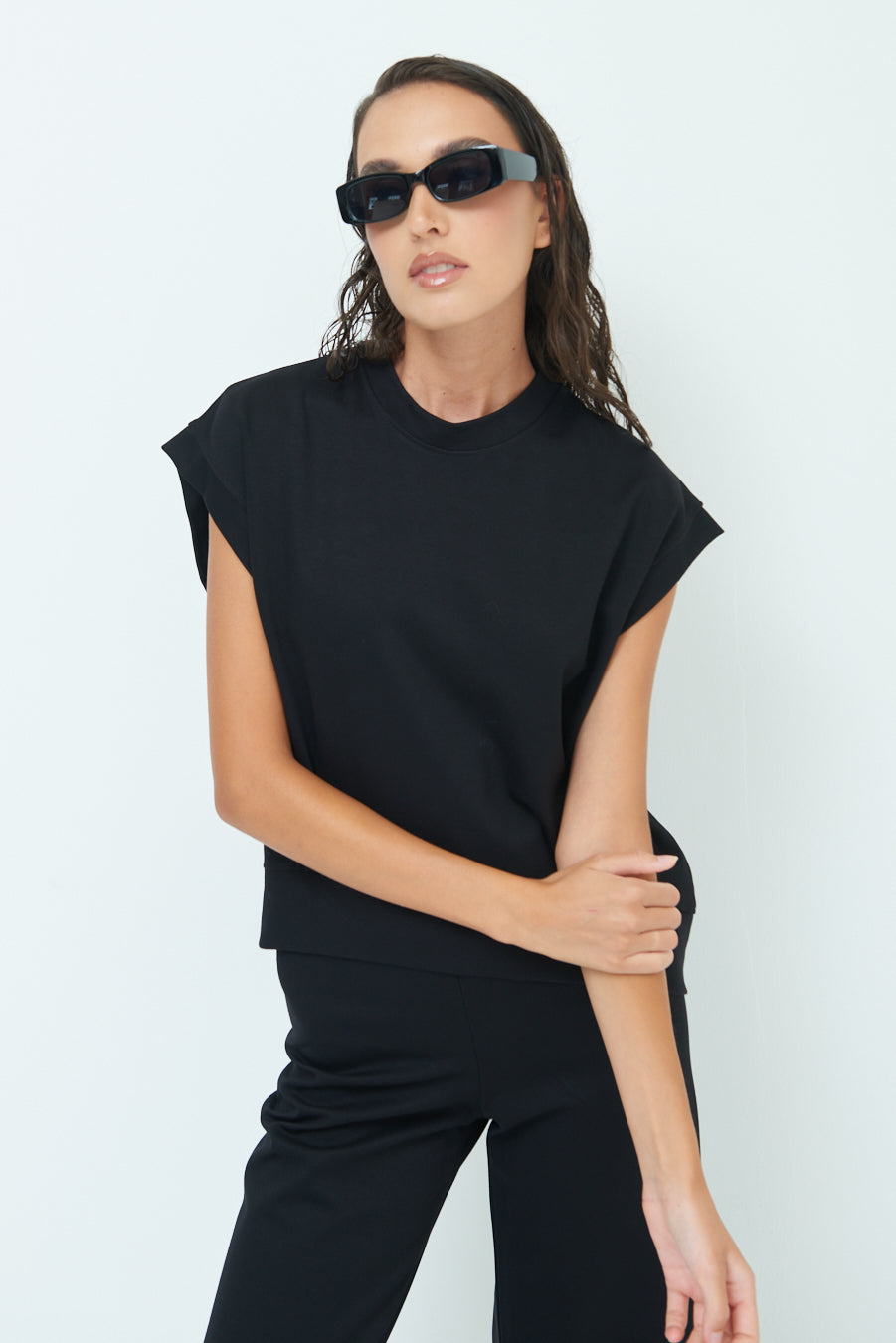 Sleeveless crew neck top with rolled sleeves wholesale