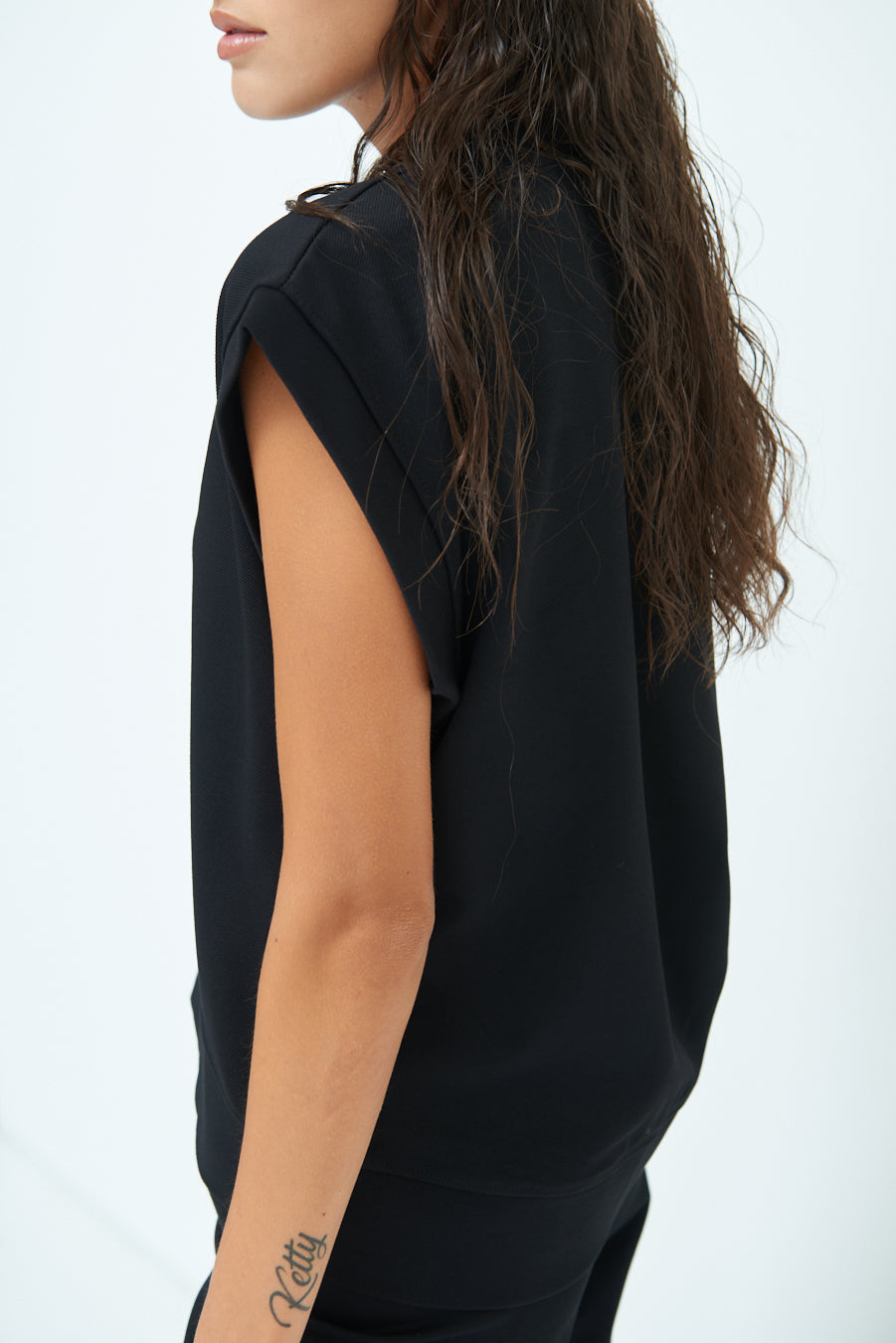 Sleeveless crew neck top with rolled sleeves wholesale