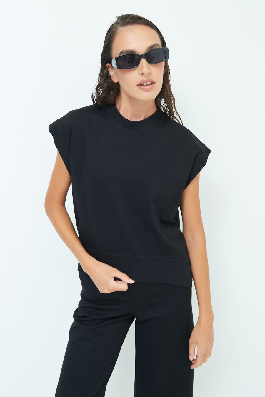 Sleeveless crew neck top with rolled sleeves wholesale