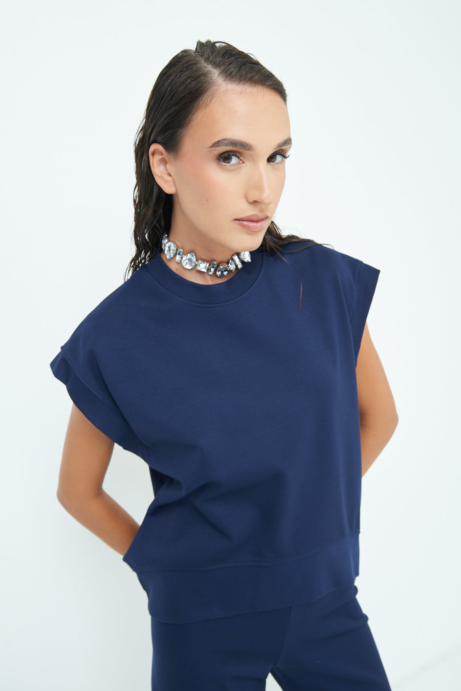 Sleeveless crew neck top with rolled sleeves wholesale