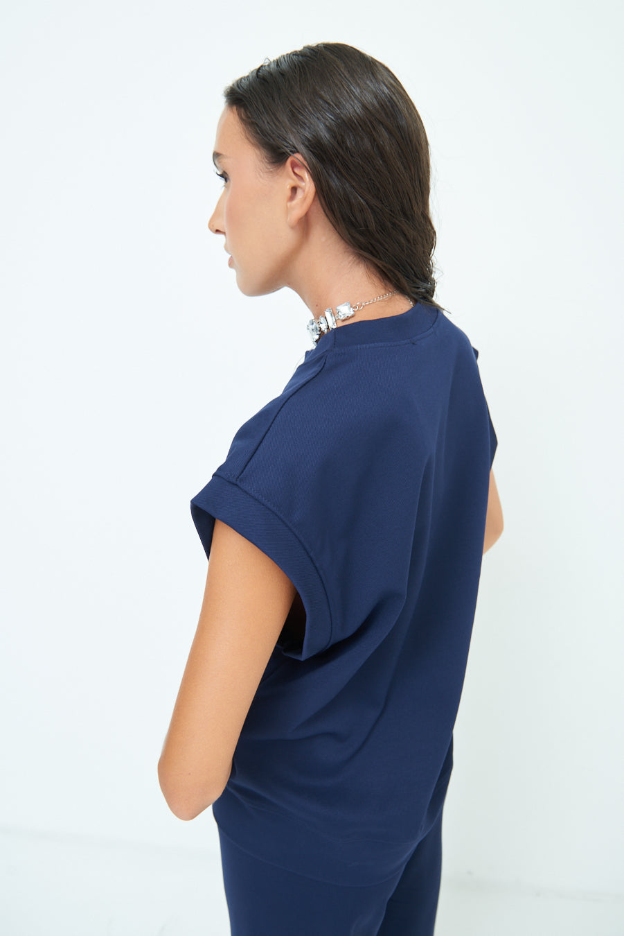 Sleeveless crew neck top with rolled sleeves wholesale