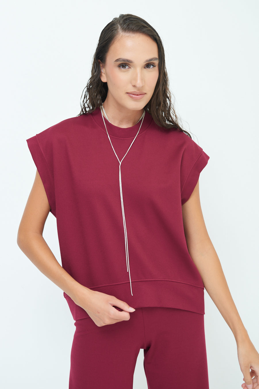 Sleeveless crew neck top with rolled sleeves wholesale