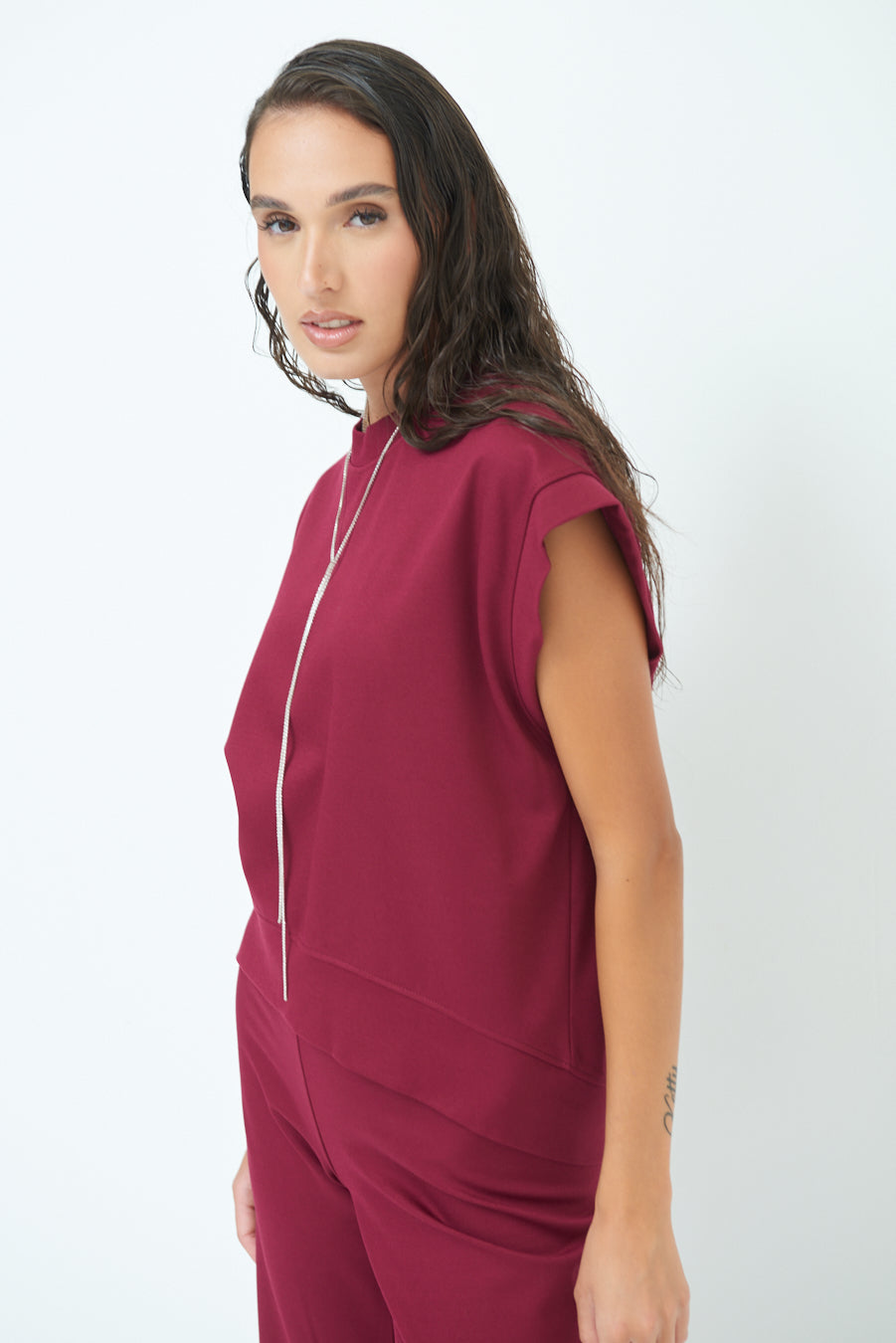 Sleeveless crew neck top with rolled sleeves wholesale
