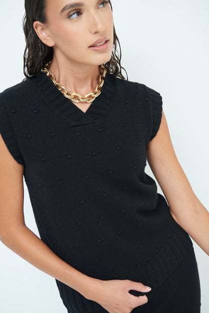 Sleeveless knit top with textured pattern wholesale