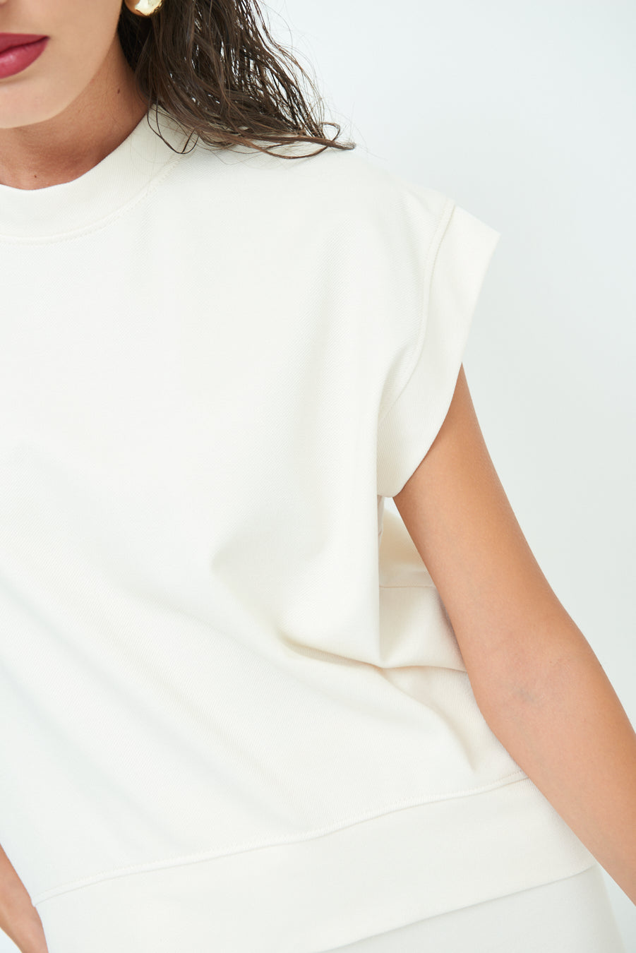 Sleeveless crew neck top with rolled sleeves wholesale