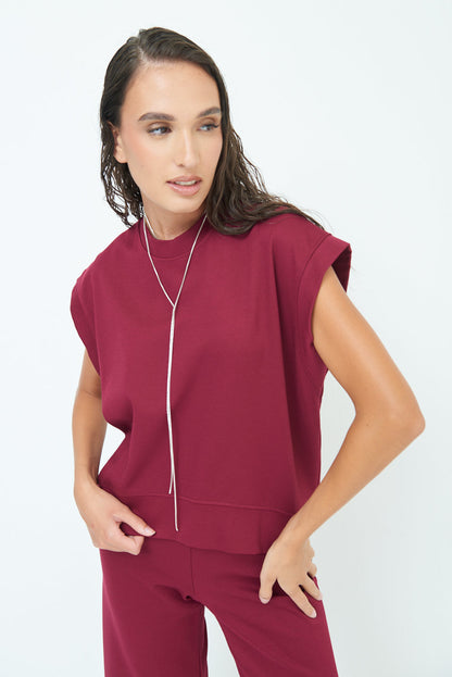 Sleeveless crew neck top with rolled sleeves wholesale